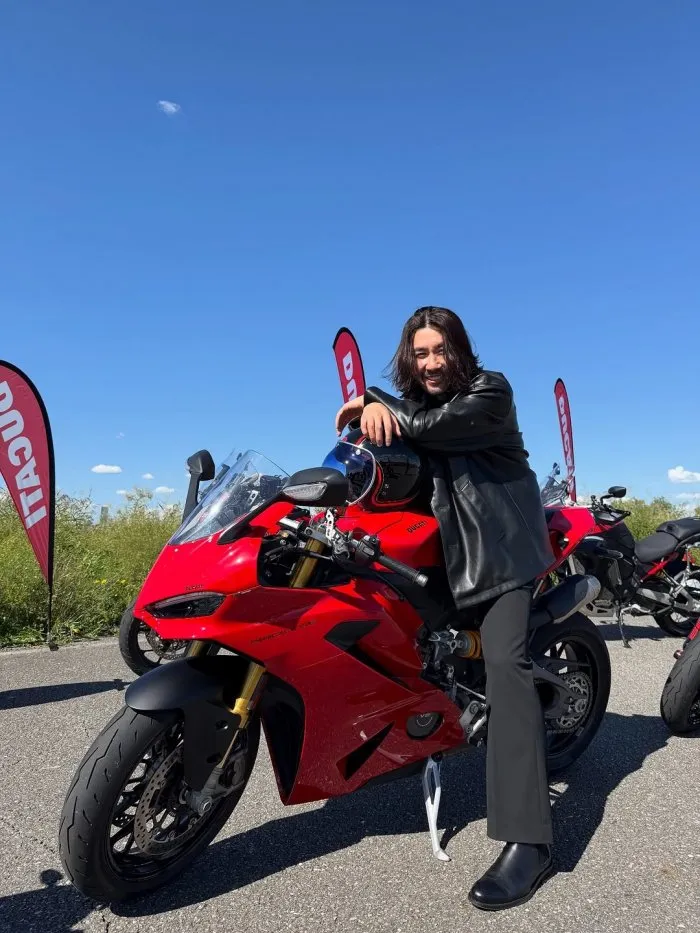 I'm Grateful to Be Me: Noh Hong-chul Poses with a Red Motorcycle
