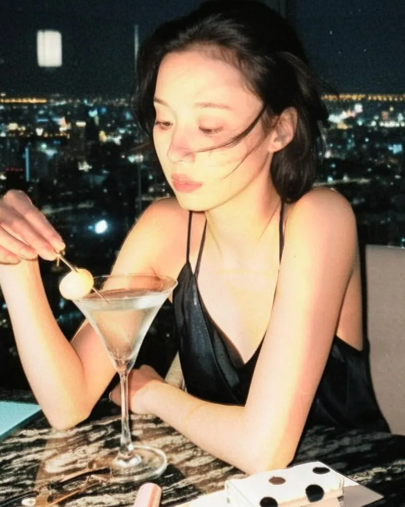 aespa’s Winter Stuns With Dreamy Bar Visuals Over a Martini